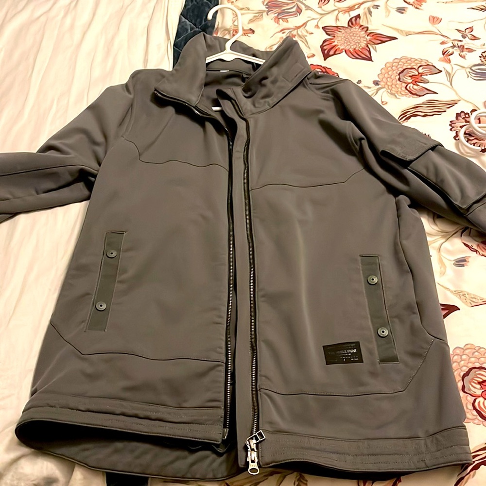 NICE Reebok Jacket with hidden hood.